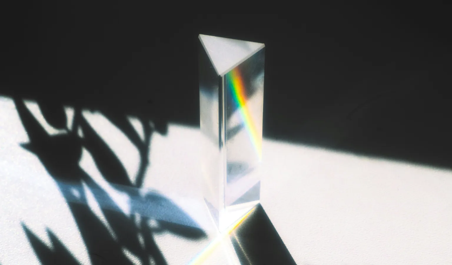 A prism breaking light into a rainbow spectrum
